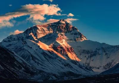 Traveler photo: Sunset casts a golden glow over the summit of Mount Everest. (December 2025)	