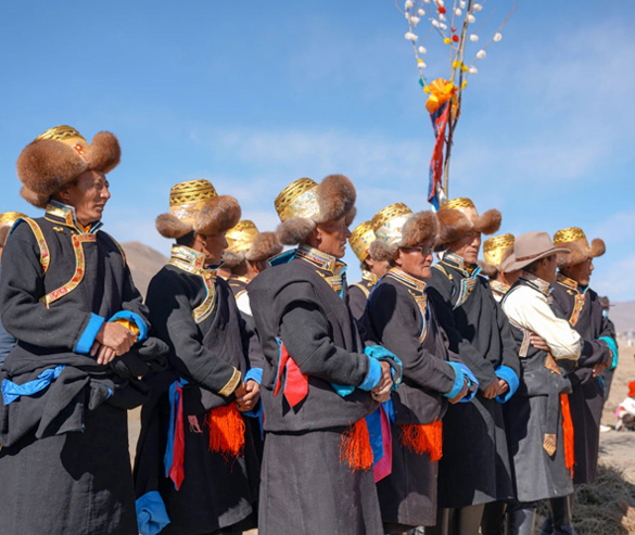 well-dressed male tibetan villagers